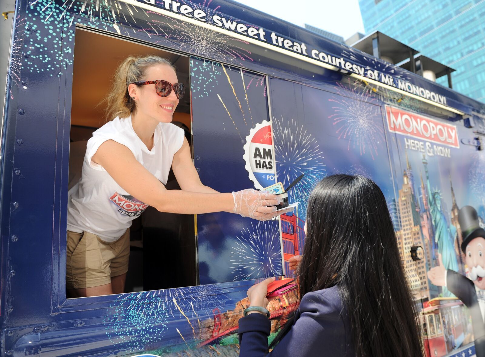 Sweeter brand ambassador handing out ice cream from a food truck at a promotional event for Monopoly
