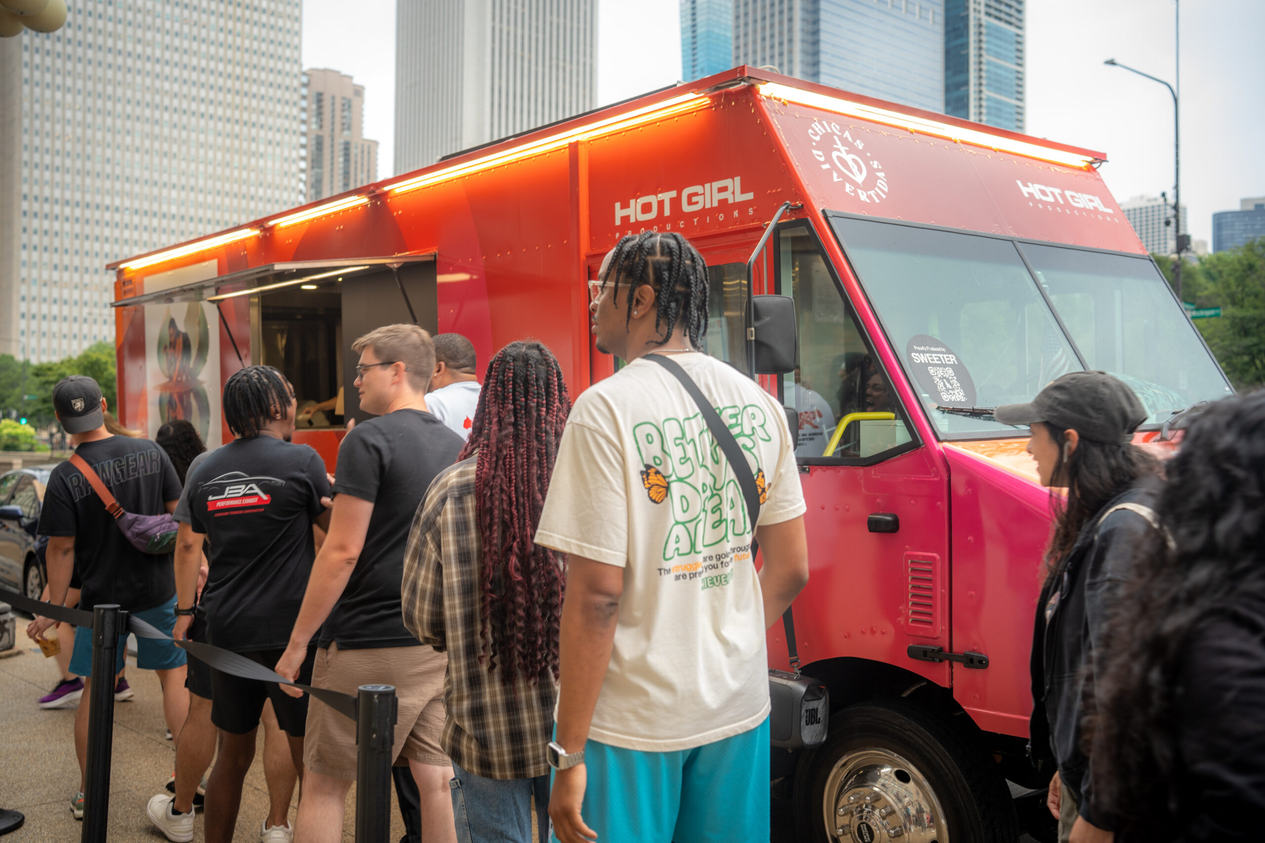 Customer line waiting beside the Megan branded food truck during the music promotion.